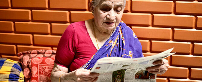 Kannada woman reading newspaper