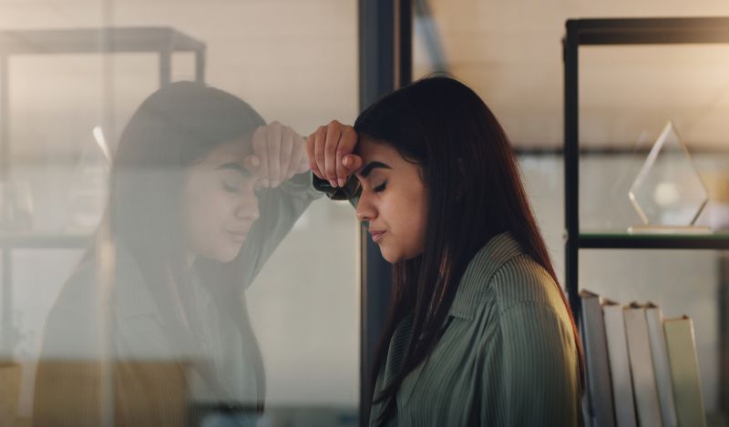 woman looking in mirror