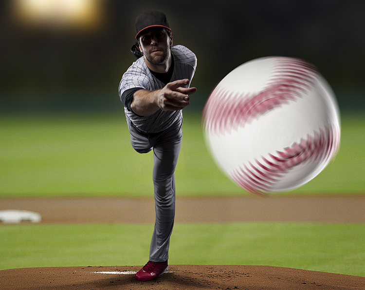 pitcher throwing baseball