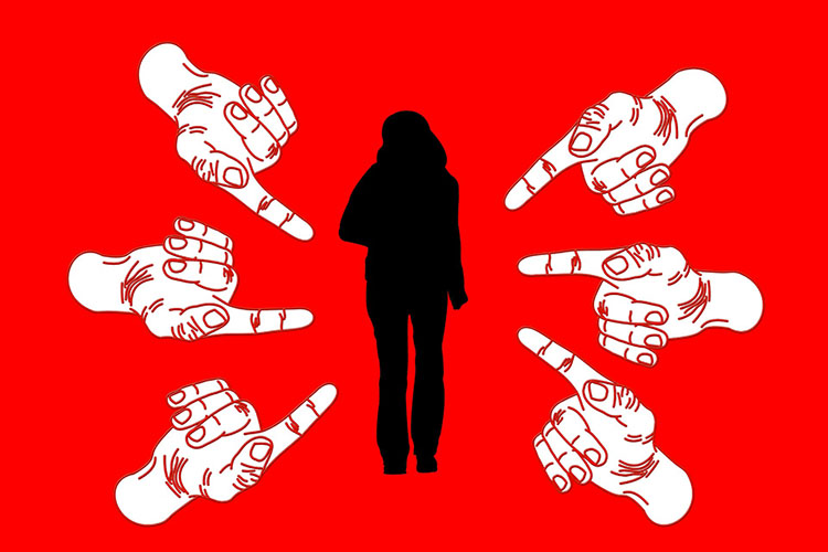 silhouette of woman with fingers pointing at her